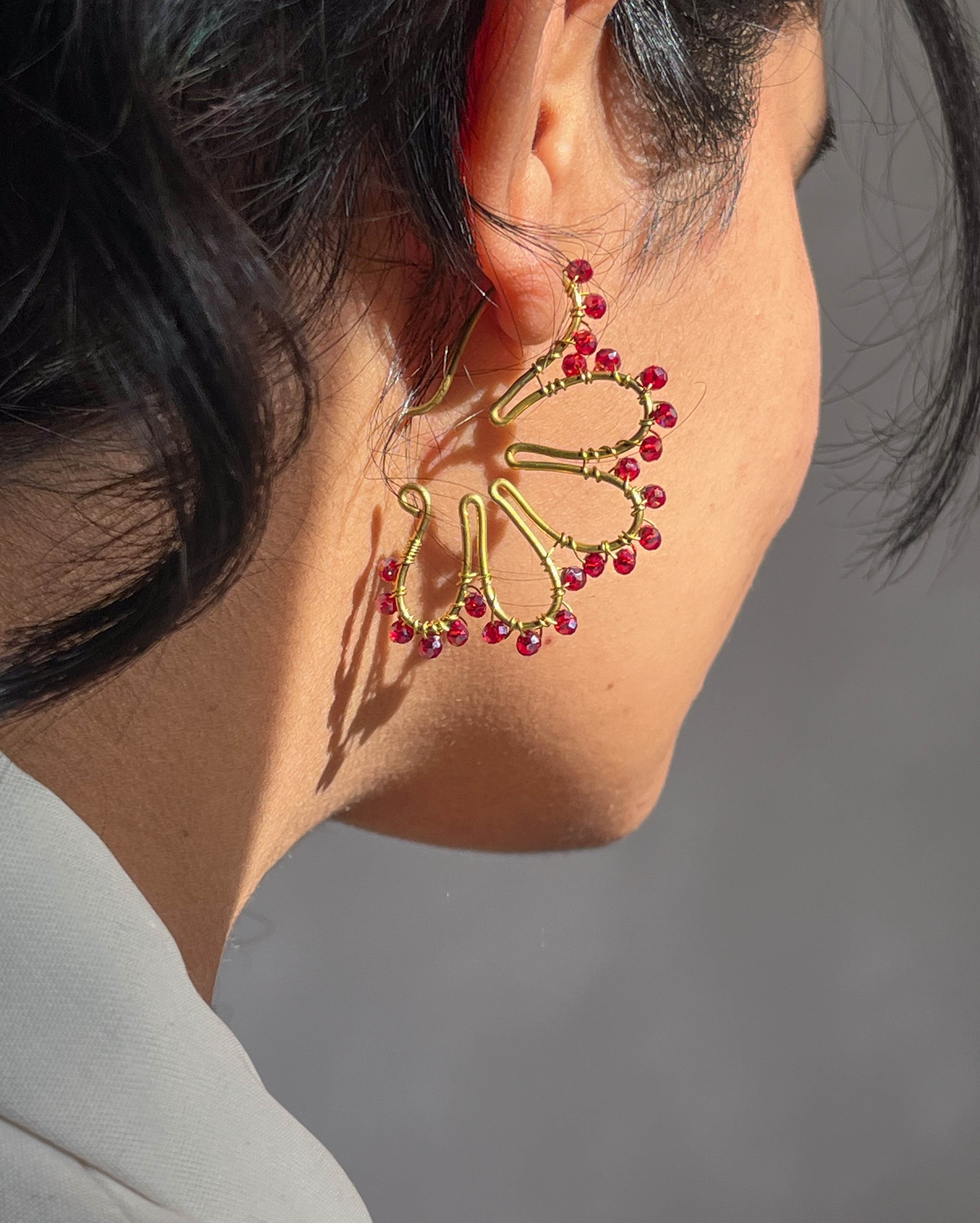 Brass flower earrings with red glass beads handmade by A Creator's Studio