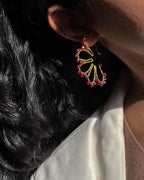 Brass flower earrings with red glass beads handmade by A Creator's Studio