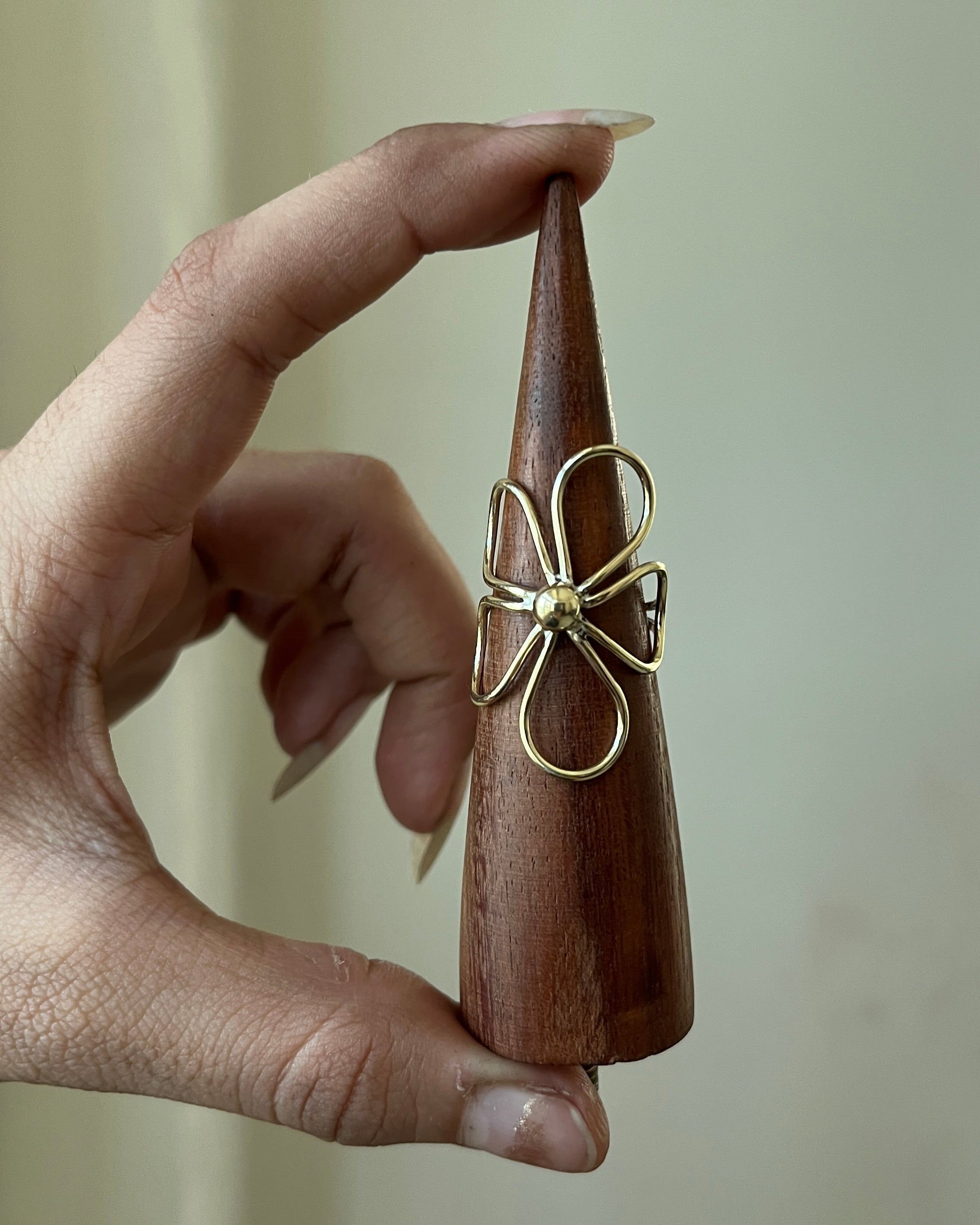 Brass ring with a flower design handmade by A Creator's Studio