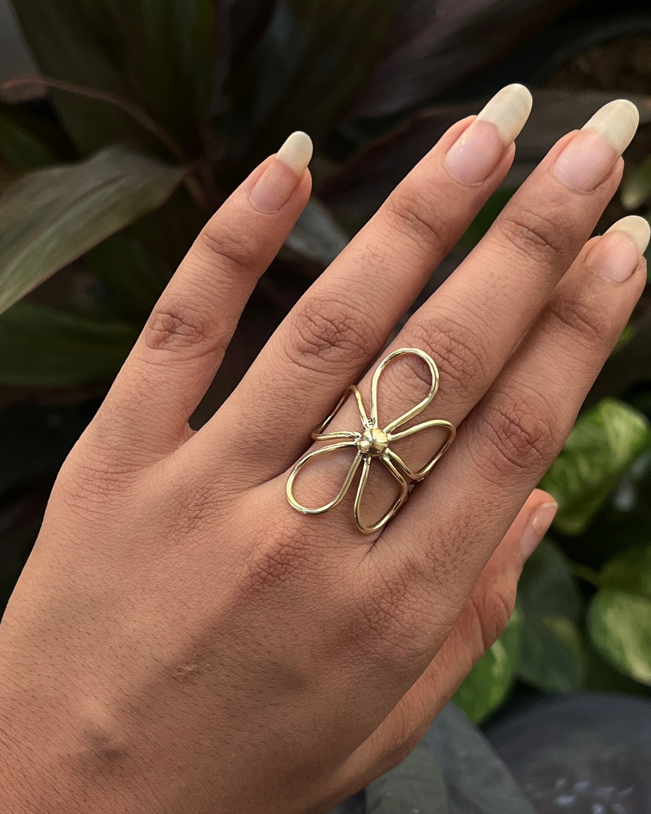 Brass ring with a flower design handmade by A Creator's Studio