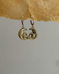 Brass earrings with unique sea wave design handmade by A Creator's Studio