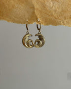 Brass earrings with unique sea wave design handmade by A Creator's Studio