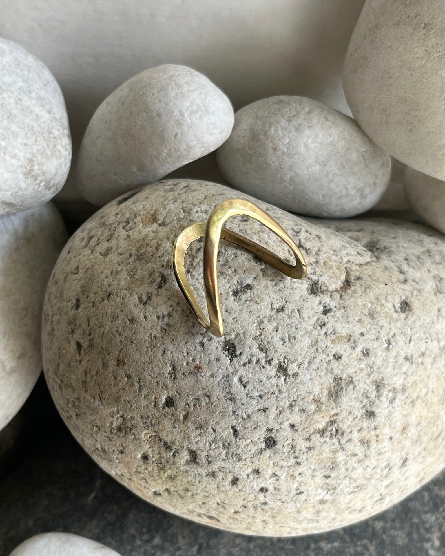 Brass ring with a unique vanki v design handmade by A Creator's Studio