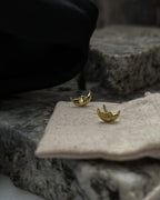 Brass moon-shaped stud earrings handmade by A Creator's Studio