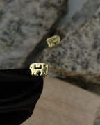 Brass tuds with unique design handmade by a creator's studio