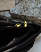 Brass spaceship-shaped stud earrings handmade by A Creator's Studio
