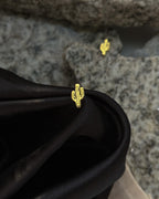 Brass tuds with unique design handmade by a creator's studio