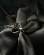 Brass ring with a evil eye design handmade by A Creator's Studio