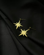 Brass earrings with unique star design handmade by A Creator's Studio