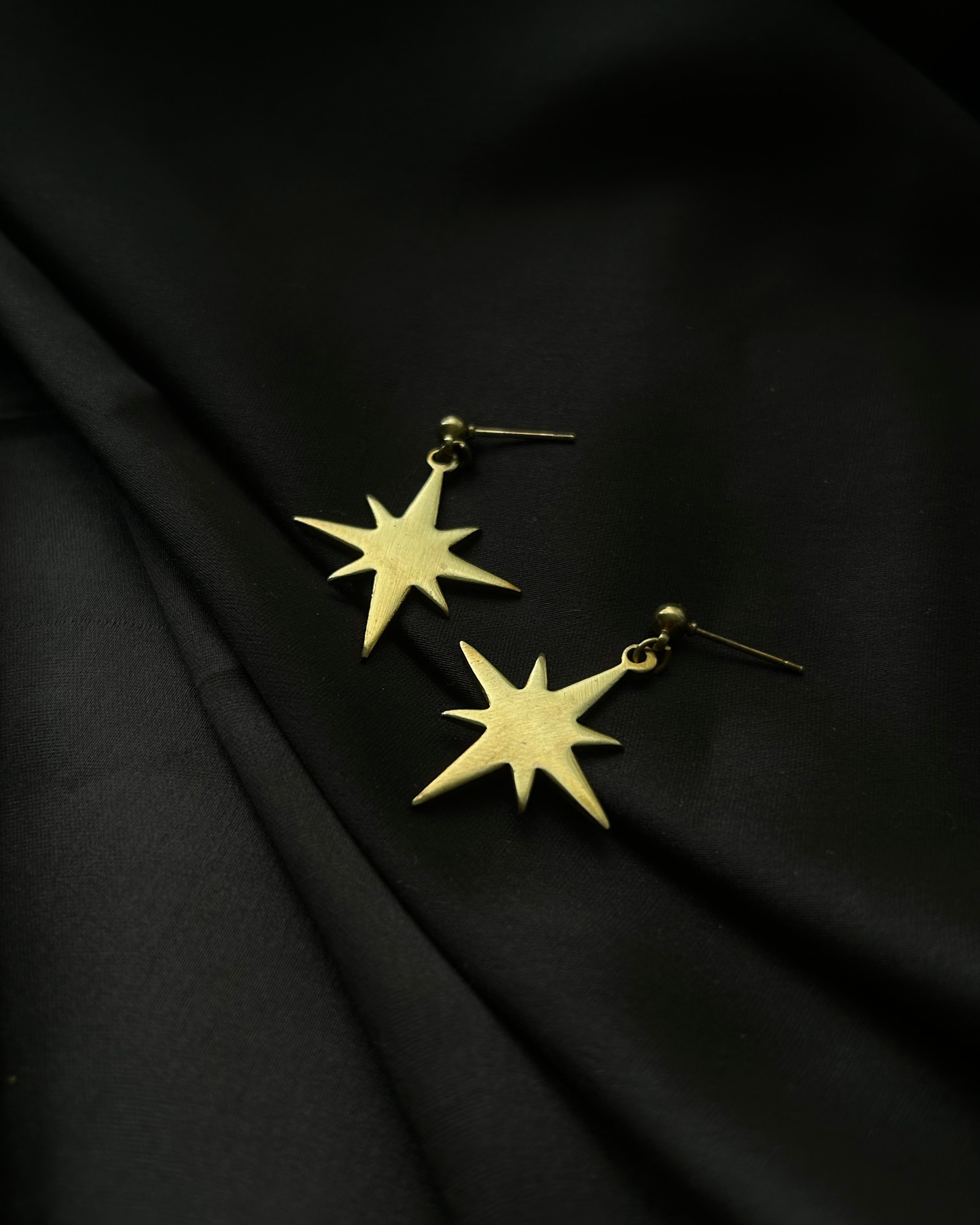 Brass earrings with unique star design handmade by A Creator's Studio