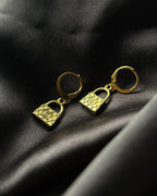Brass earrings handmade by A Creator's Studio