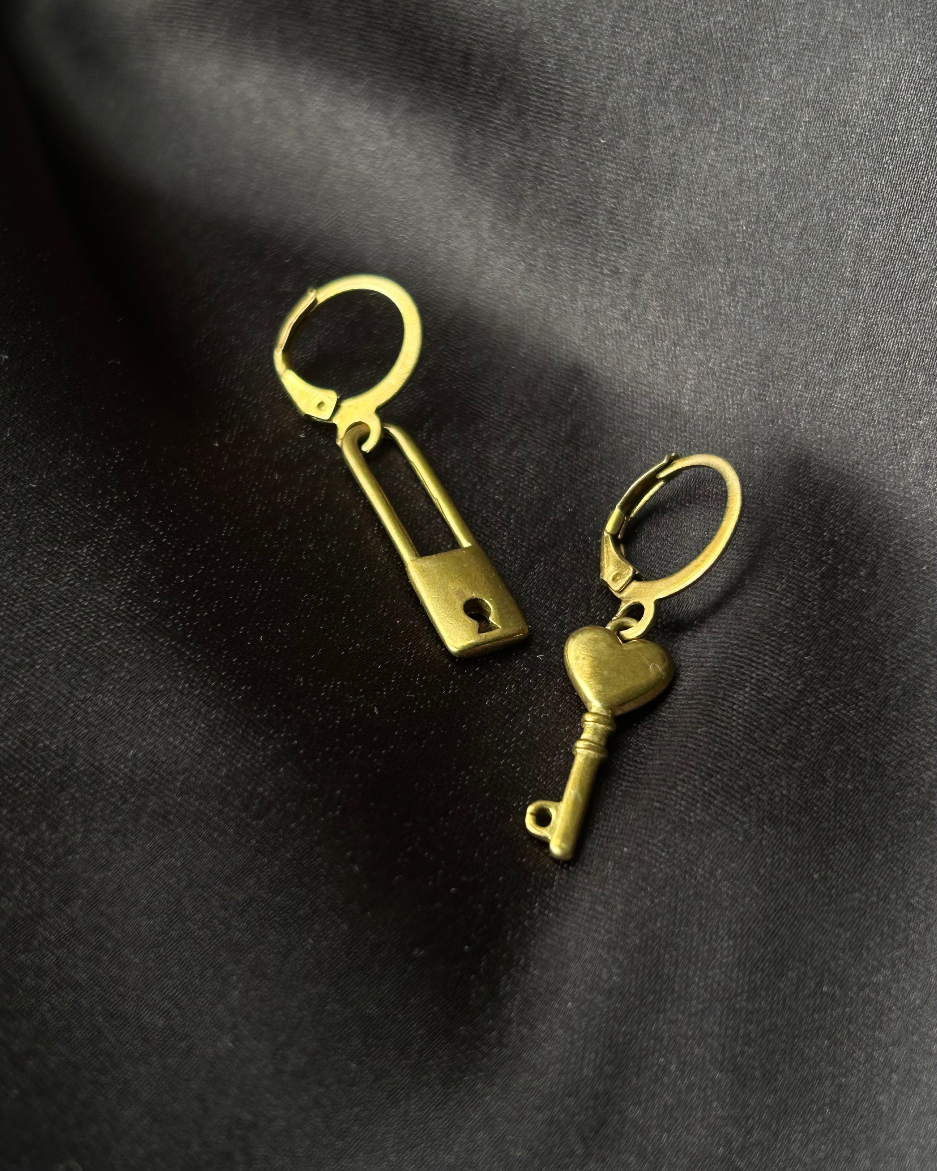Brass earrings with unique lock and key design handmade by A Creator's Studio