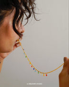 Gold plated necklace with rainbow coloured beads handmade by A Creator's Studio