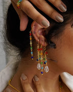 Gold Plated Astral rainbow earrings made with rainbow coloured glass beads handmade by A Creator's Studio