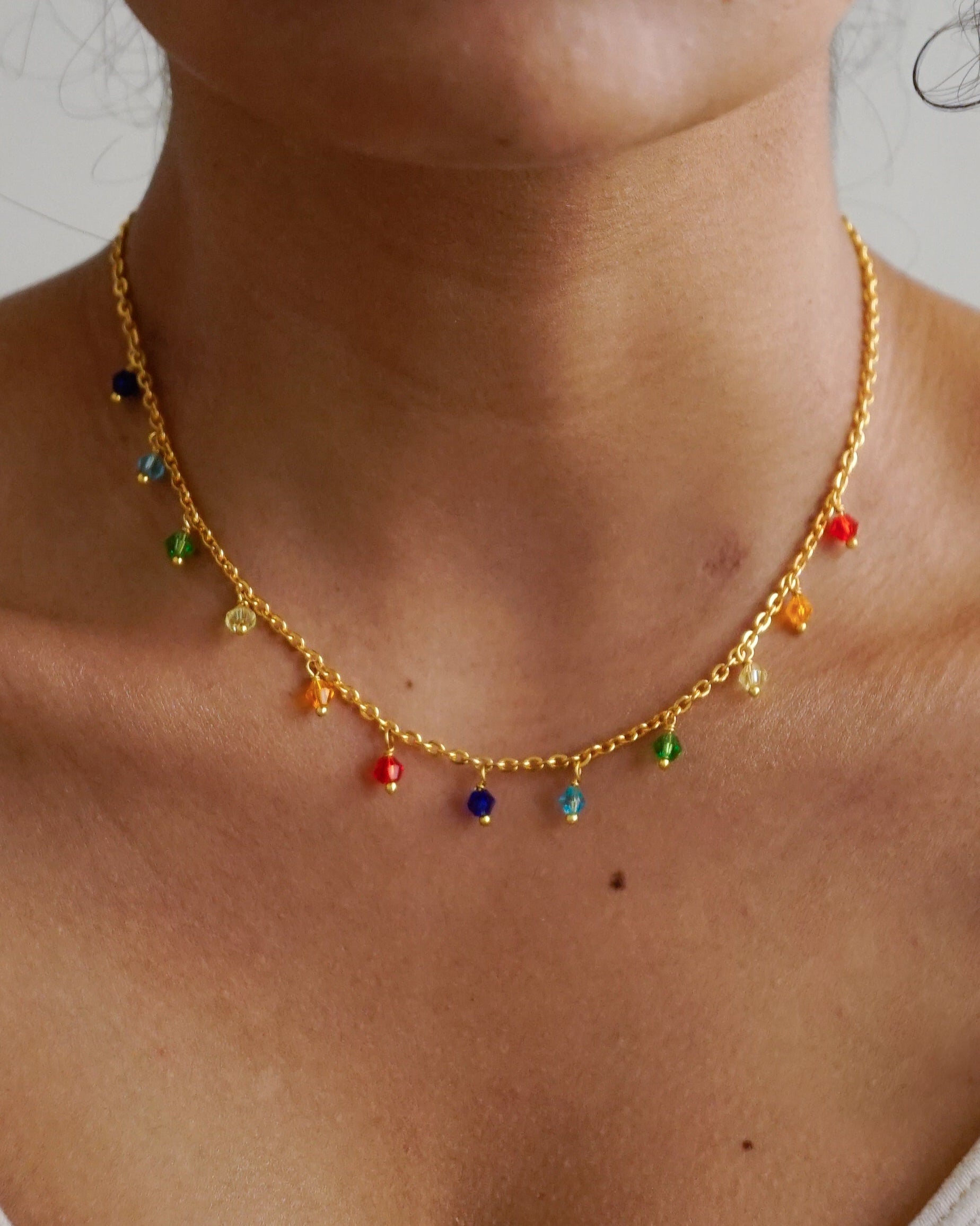 Gold plated necklace with rainbow coloured beads handmade by A Creator's Studio