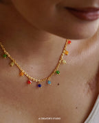 Gold Plated necklace with rainbow coloured glass beads handmade by A Creator's Studio