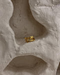 Brass ring with a unique hug design handmade by A Creator's Studio