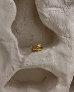 Brass ring with a unique hug design handmade by A Creator's Studio