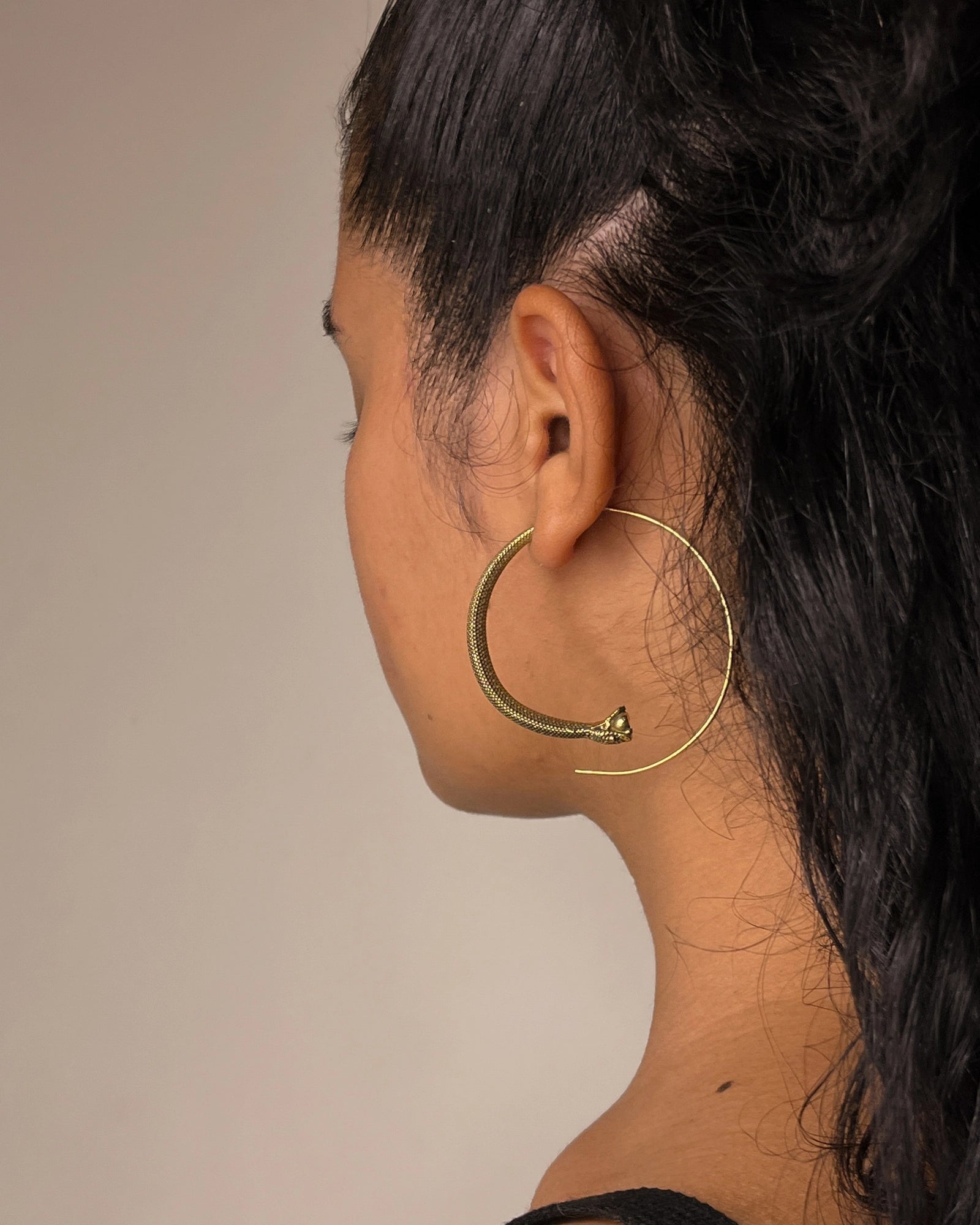 Brass snake hoop earrings handmade by A Creator's Studio