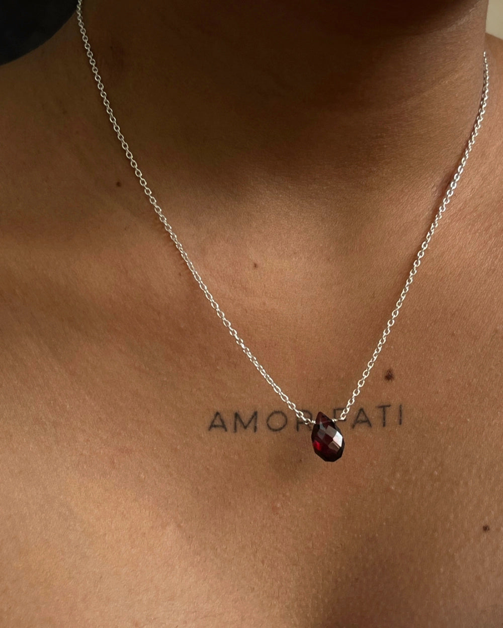 Dainty Silver Chain with a garnet drop pendant handmade by A Creator's Studio 