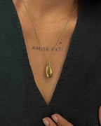 Brass necklace with a coffee bean pendant handmade by A Creator's Studio