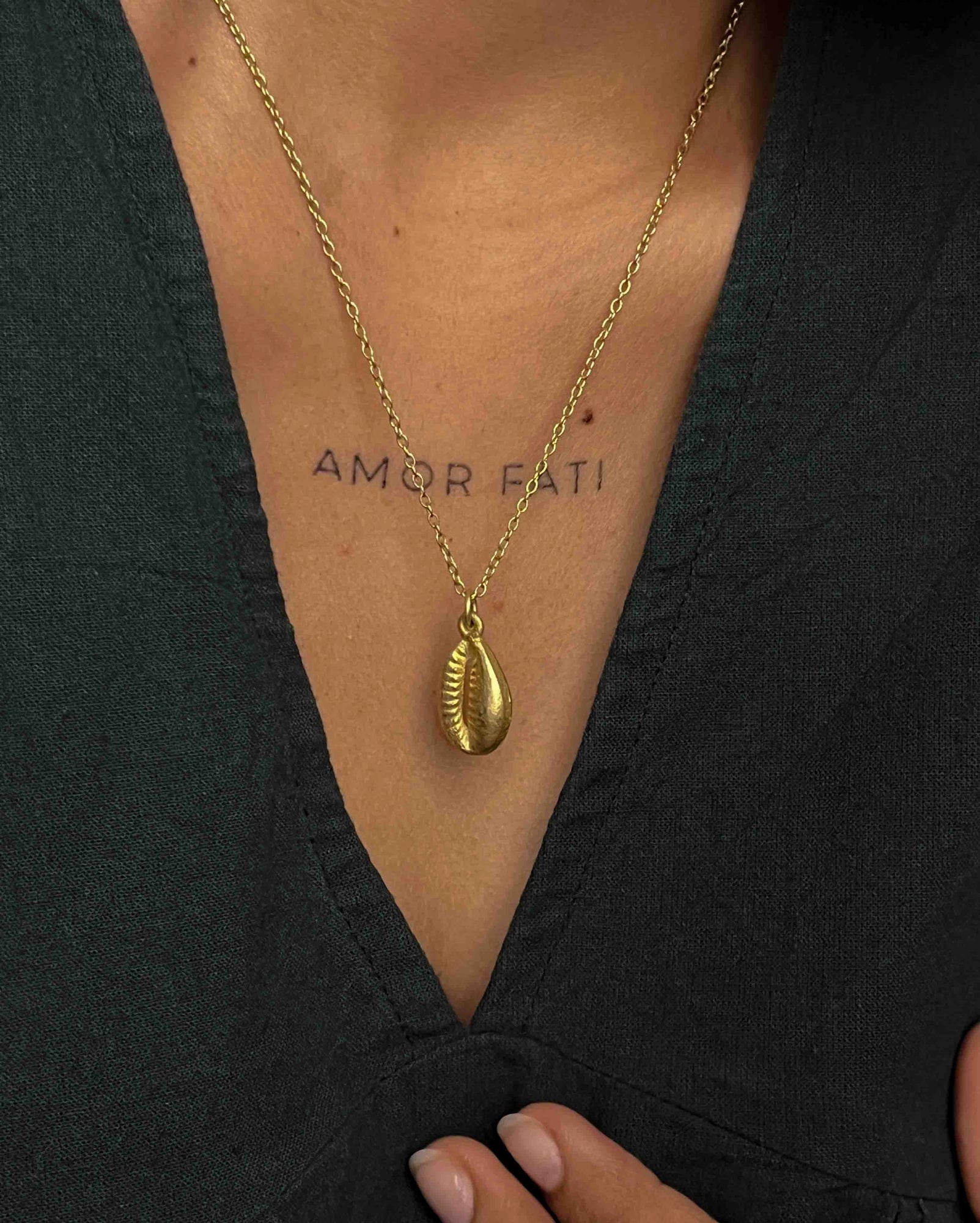 Brass necklace with a coffee bean pendant handmade by A Creator's Studio