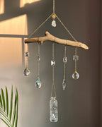 upcycled sun catcher with glass crystals, a wooden log base and a geode handmade by A Creator's Studio