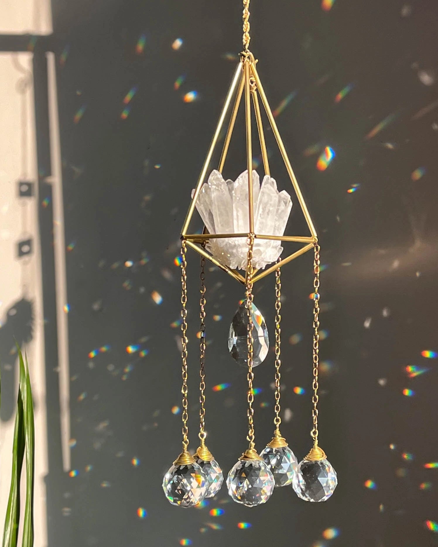 Clear Quartz Crystal sun catcher with a clear quartz cluster in a 3d wired frame and glass crystal drops, handmade by A Creator's Studio