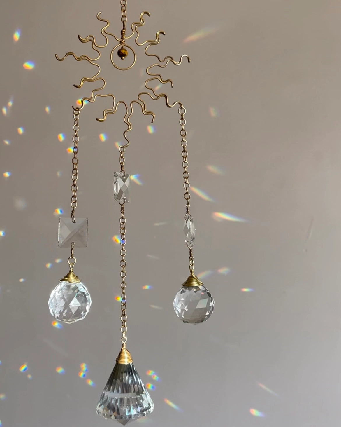Wired sun suncatcher with clear crystals handmade by A Creator's Studio 