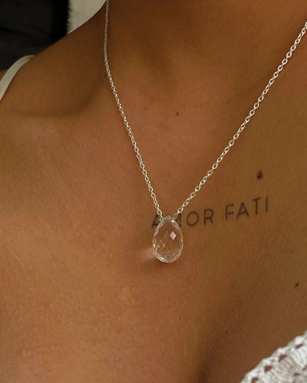Dainty Silver Chain with a clear quartz drop pendant handmade by A Creator's Studio