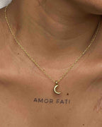 Brass necklace with a crescent moon pendant handmade by A Creator's Studio