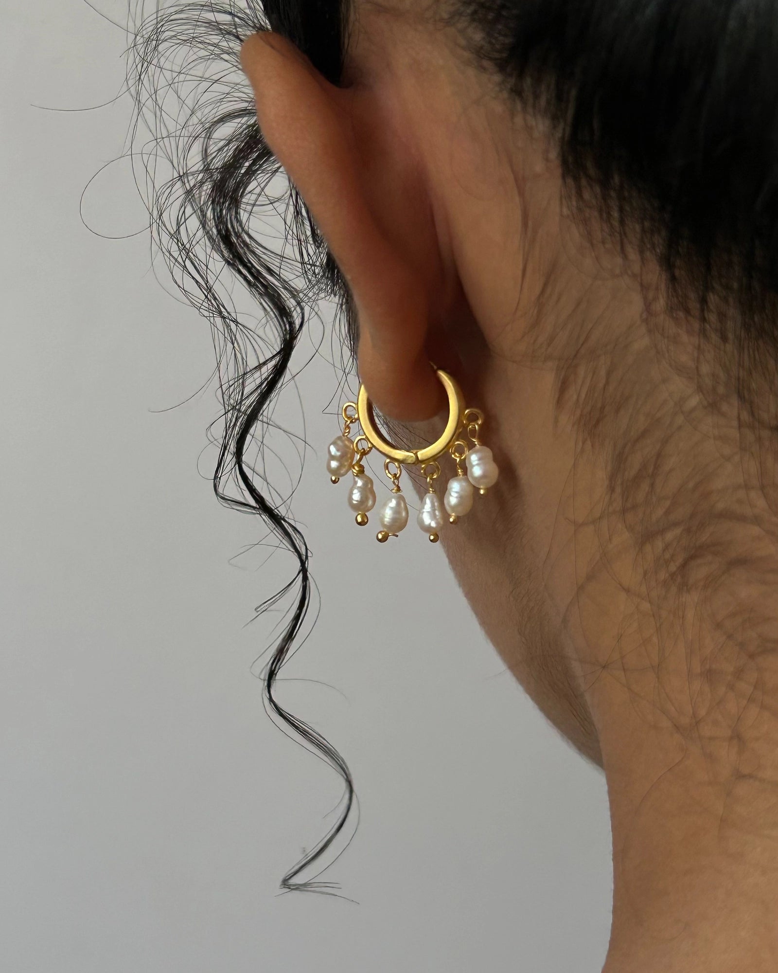 gold plated White lustrous freshwater pearl chandelier earrings with multiple freshwater pearl drops handmade by A Creator's Studio