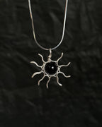 Sterling Silver Necklace with a wire wrapped sun pendant with a black onyx gemstone handmade by A Creator's Studio