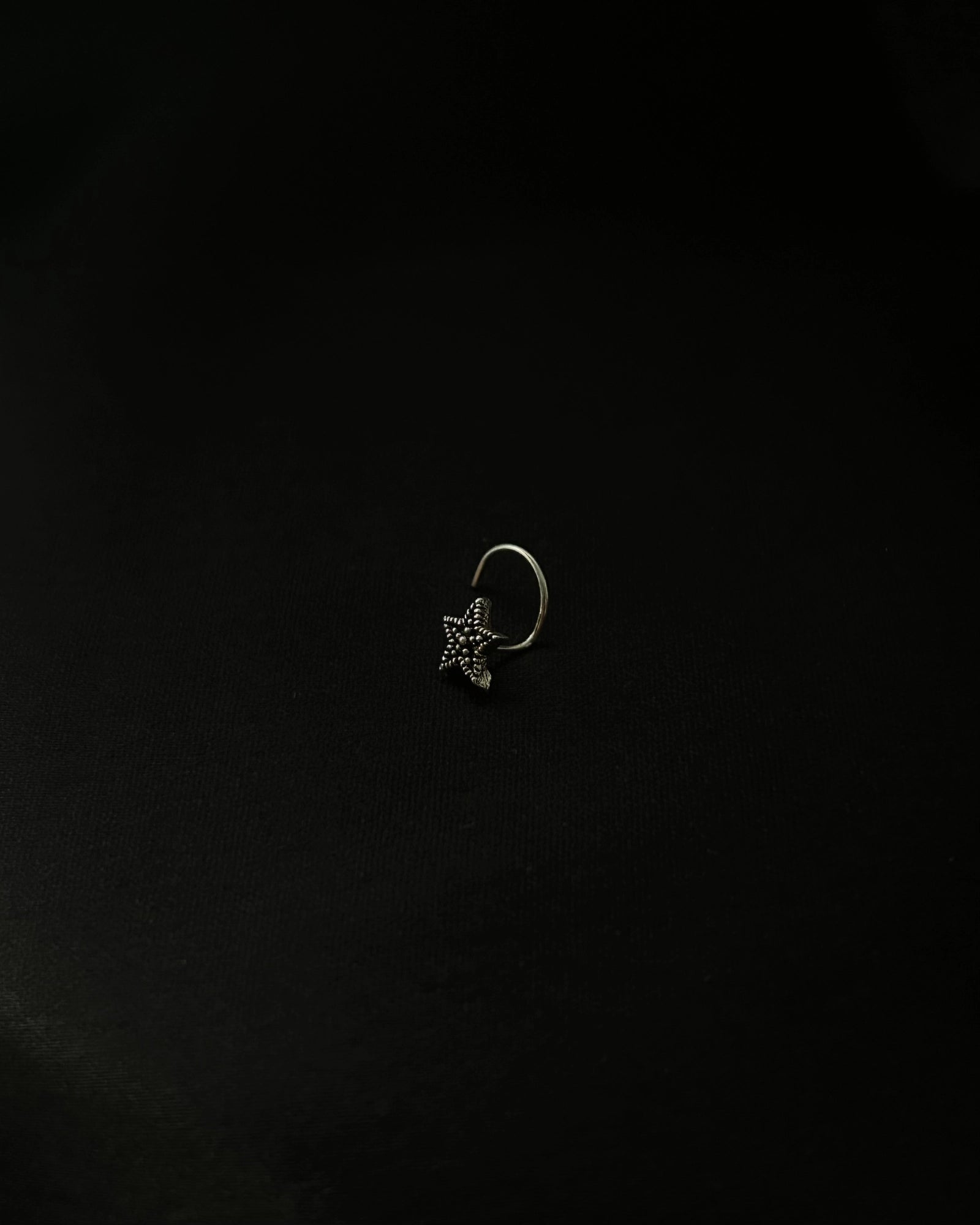 Silver oxidised star nose ring for pierced nose handmade by A Creator's Studio