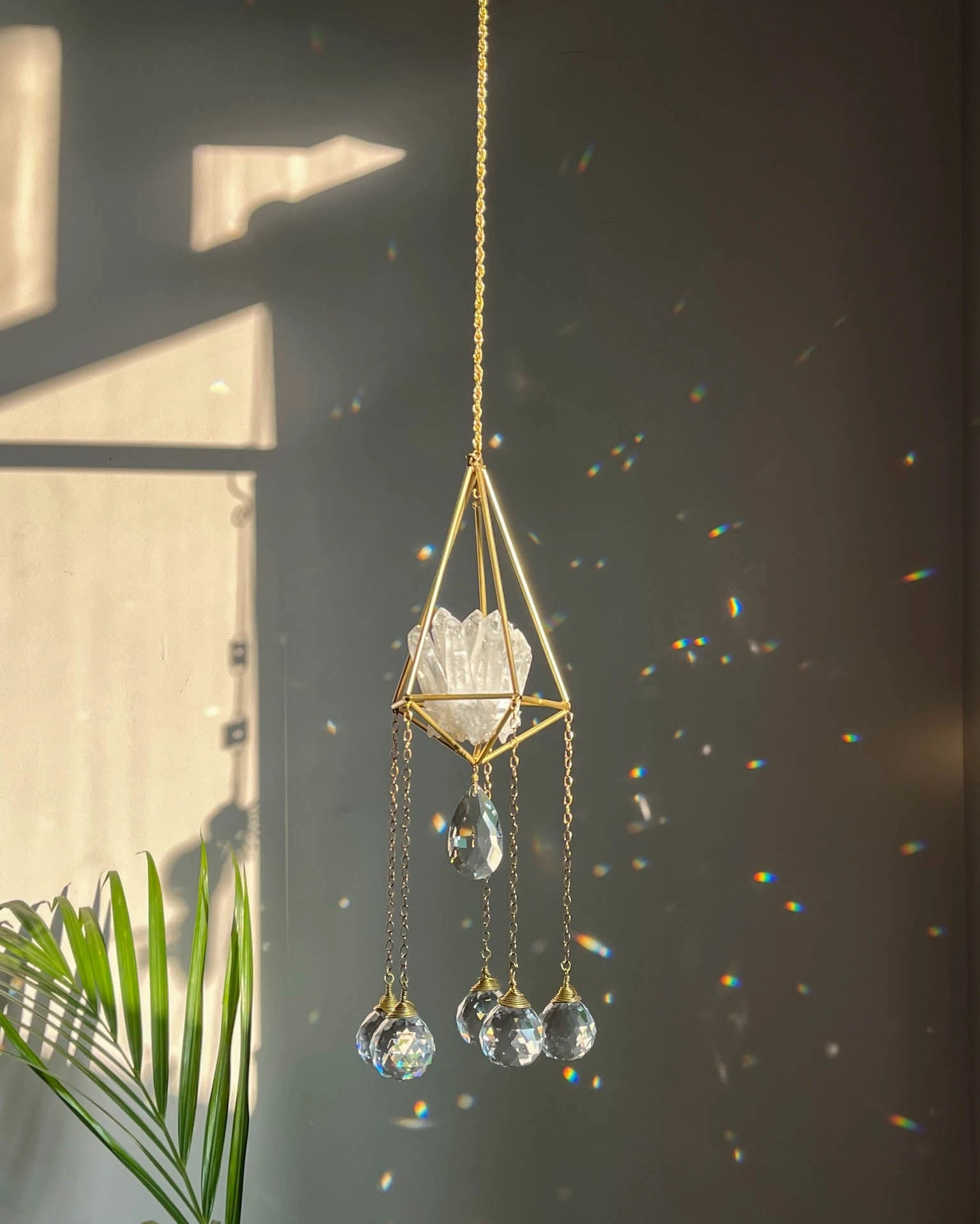Clear Quartz Crystal sun catcher with a clear quartz cluster in a 3d wired frame and glass crystal drops, handmade by A Creator's Studio