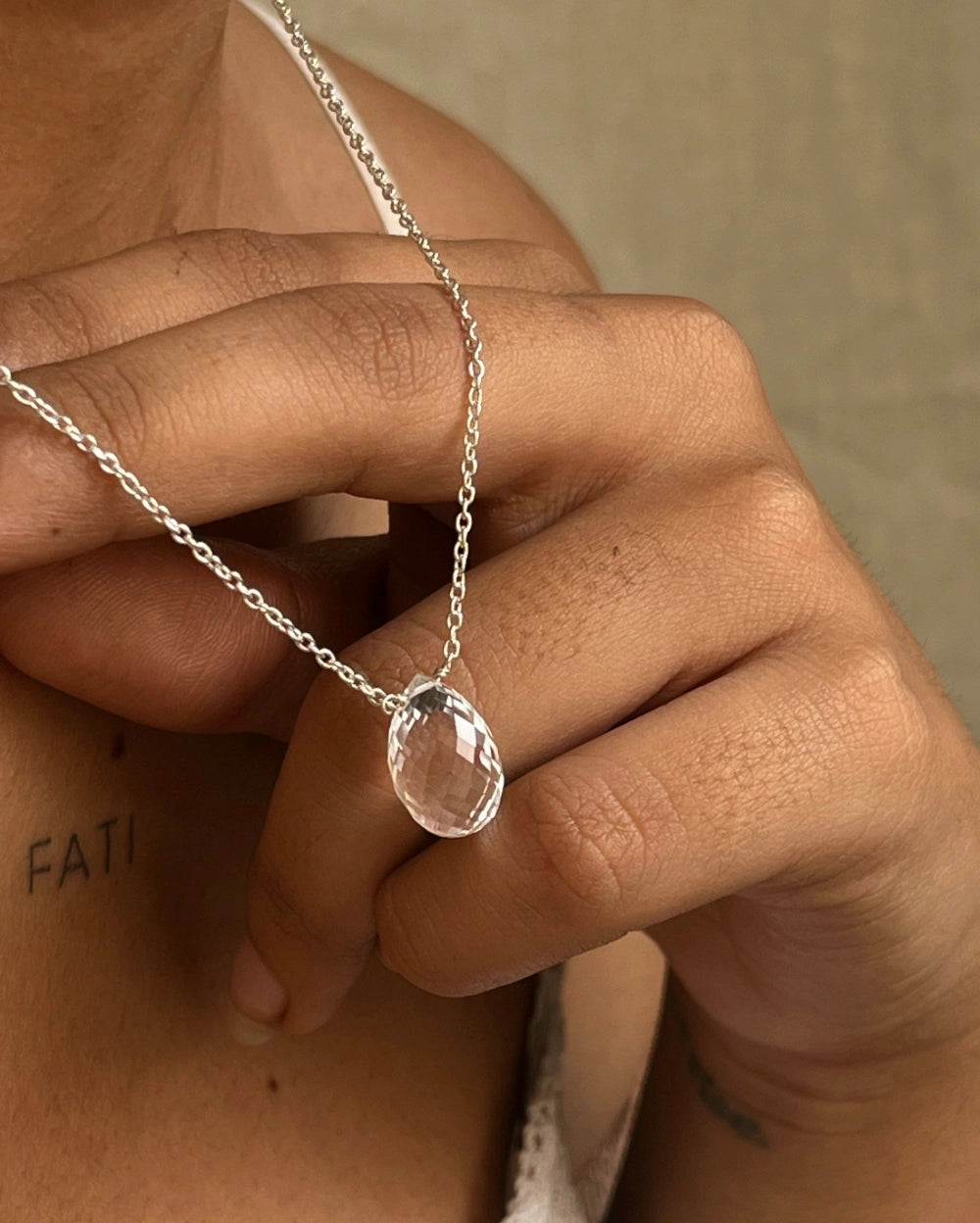 Dainty Silver Chain with a clear quartz drop pendant handmade by A Creator's Studio