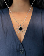 Sterling Silver Necklace with a wire wrapped sun pendant with a black onyx gemstone handmade by A Creator's Studio