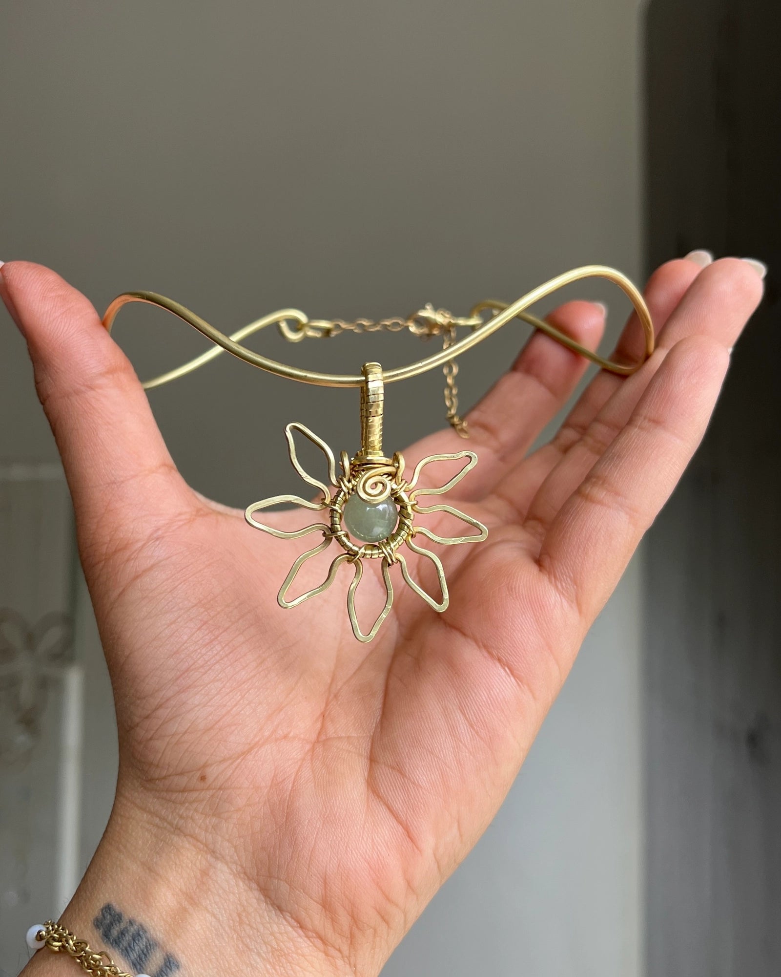 Brass wired sunflower choker with gemstone in the centre handmade by A Creator's Studio