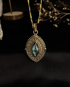 Brass box (dibbi) pendant with a large labradorite sitting in the centre with a chain handmade by A Creator's Studio