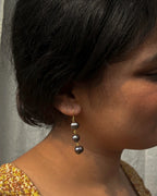 gold plated Classic black pearl dangle earrings with three lustrous black freshwater pearls handmade by A Creator's Studio