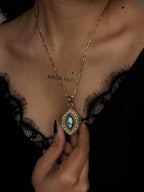 Brass box (dibbi) pendant with a large labradorite sitting in the centre with a chain handmade by A Creator's Studio