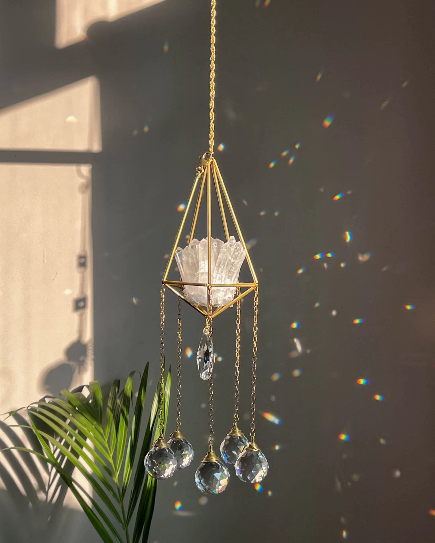Clear Quartz Crystal sun catcher with a clear quartz cluster in a 3d wired frame and glass crystal drops, handmade by A Creator's Studio