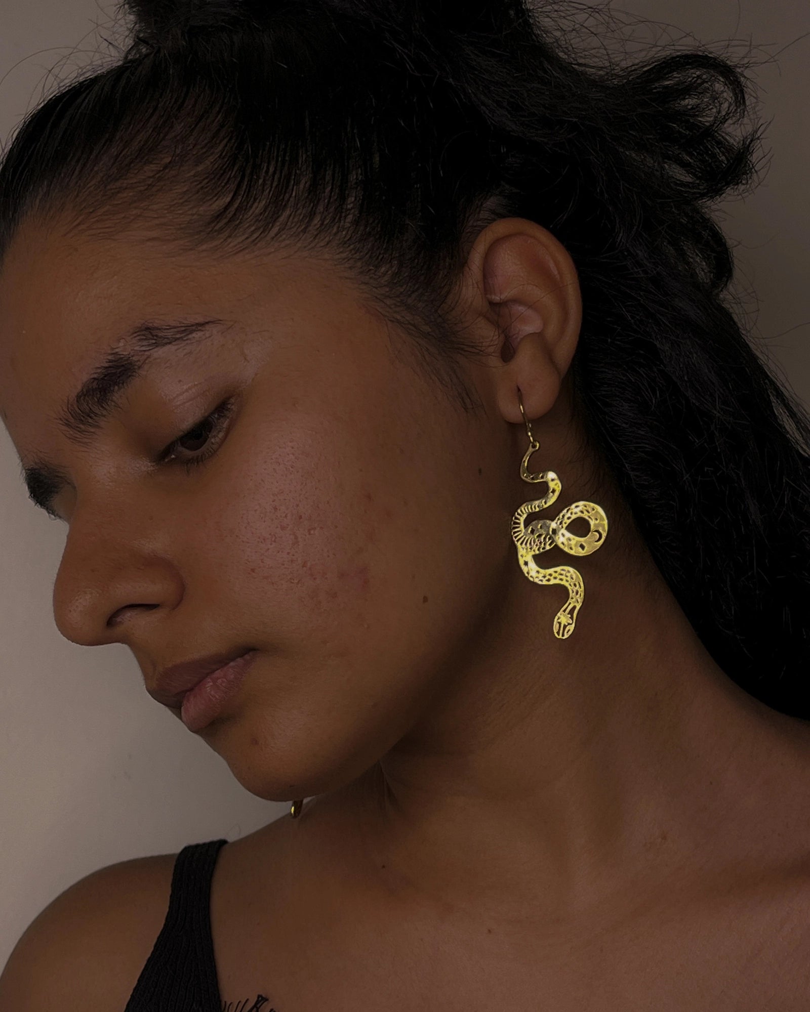 brass snake earrings handmade by a creator's studio