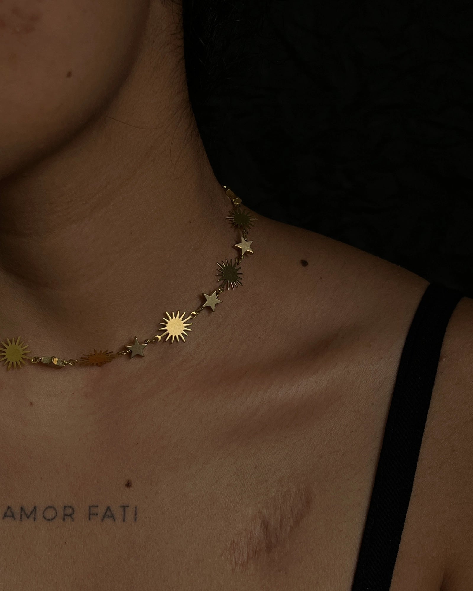 Brass star and sun link necklace with stars and suns linked together handmade by A Creator's Studio