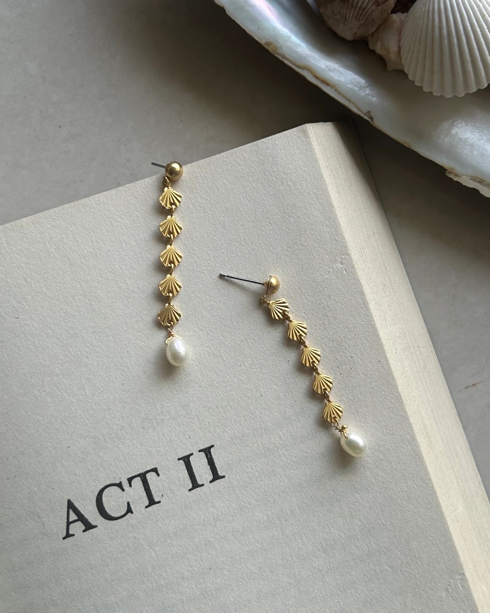 Gold Plated seashell dangle earrings with a fresh water pearl drop handmade by A Creator's Studio