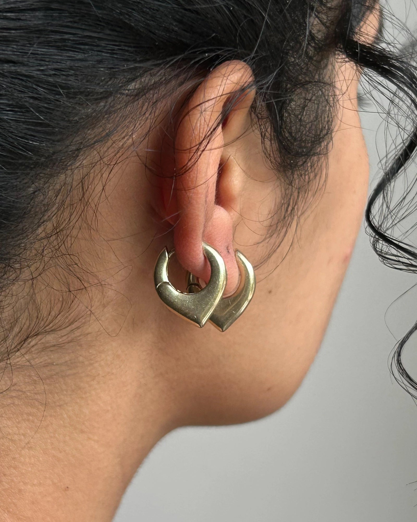 Brass dagger hoop earrings handmade by A Creator's Studio