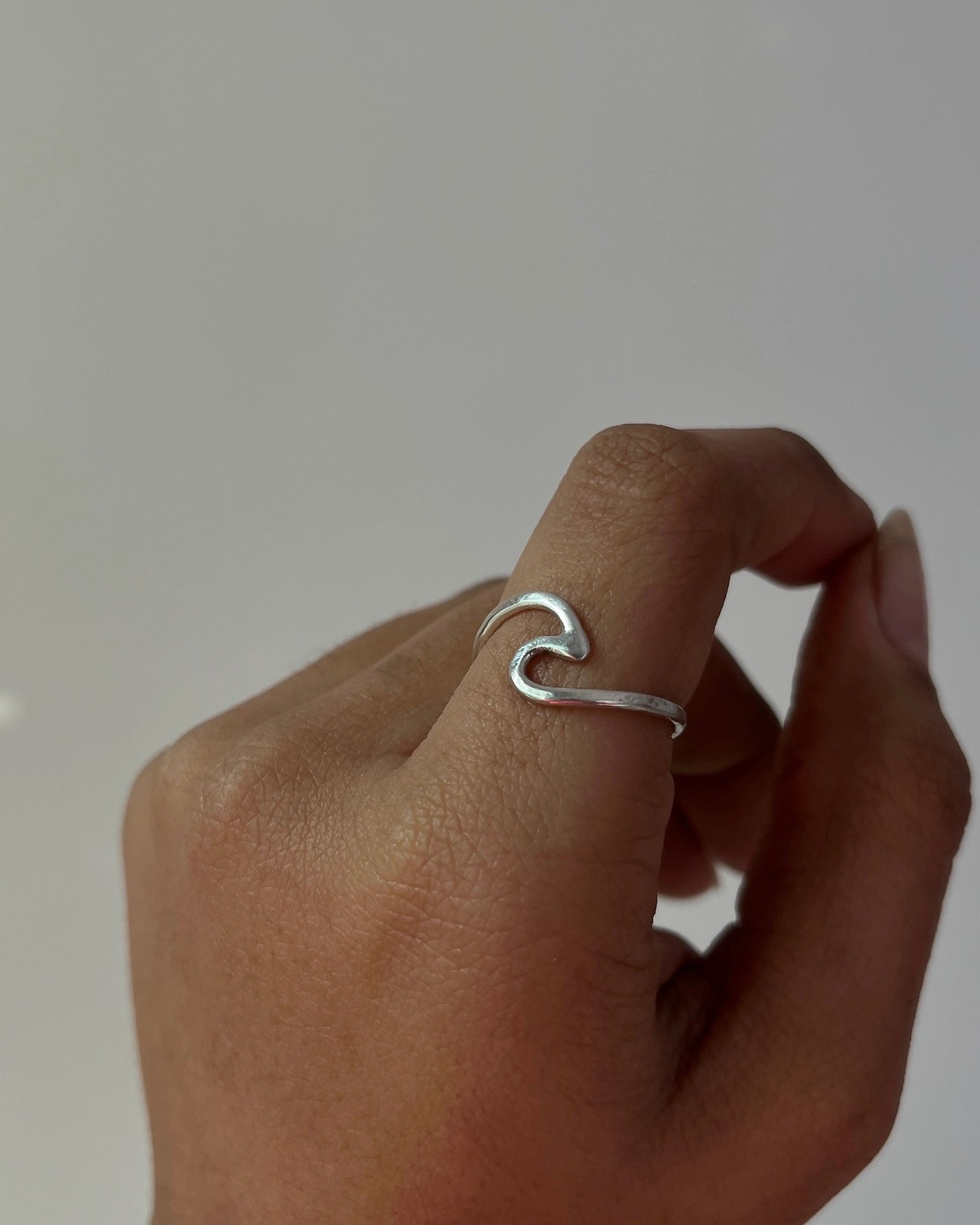 Silver ring with a wave in the centre handmade by A Creator's Studio