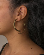 Brass snake hoop earrings handmade by A Creator's Studio