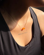 Brass necklace with orange Carnelian crystal bead in the centre handmade by A Creator's Studio