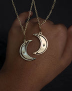 Brass necklace with a swinging and engraved crescent moon pendant handmade by A Creator's Studio
